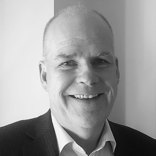 Black and white image of Board Member and Chair of Finance, Audit and Risk Committee Damian Kennedy