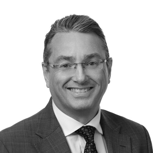 Black and white image of Chief Executive Officer of Circle Voluntary Housing Association John Hannigan