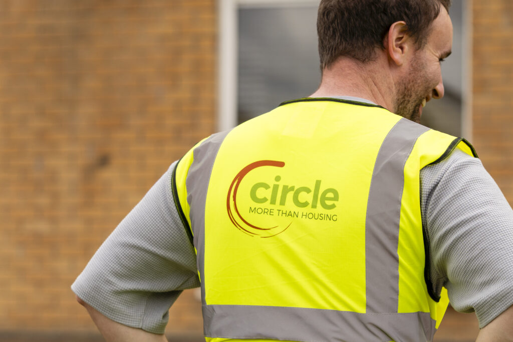 Circle logo printed on a high vis jacket.