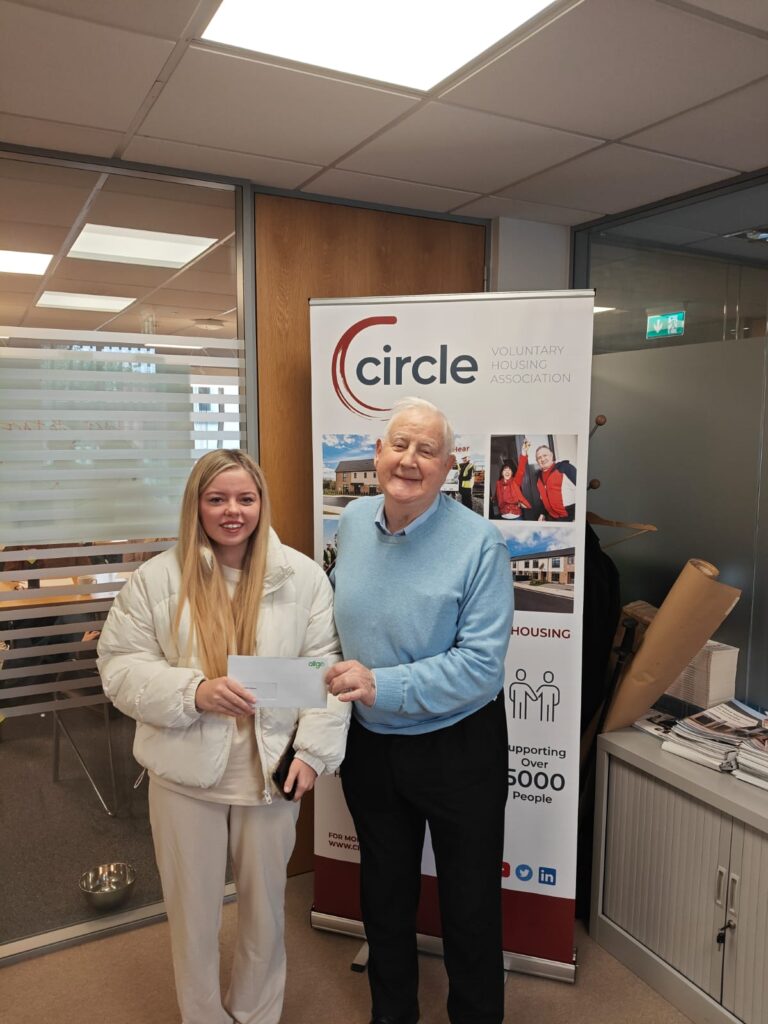 Fr.Patsy Carolan with Circle Tenant, presenting the cheque for the Tenant Educational Bursary. 