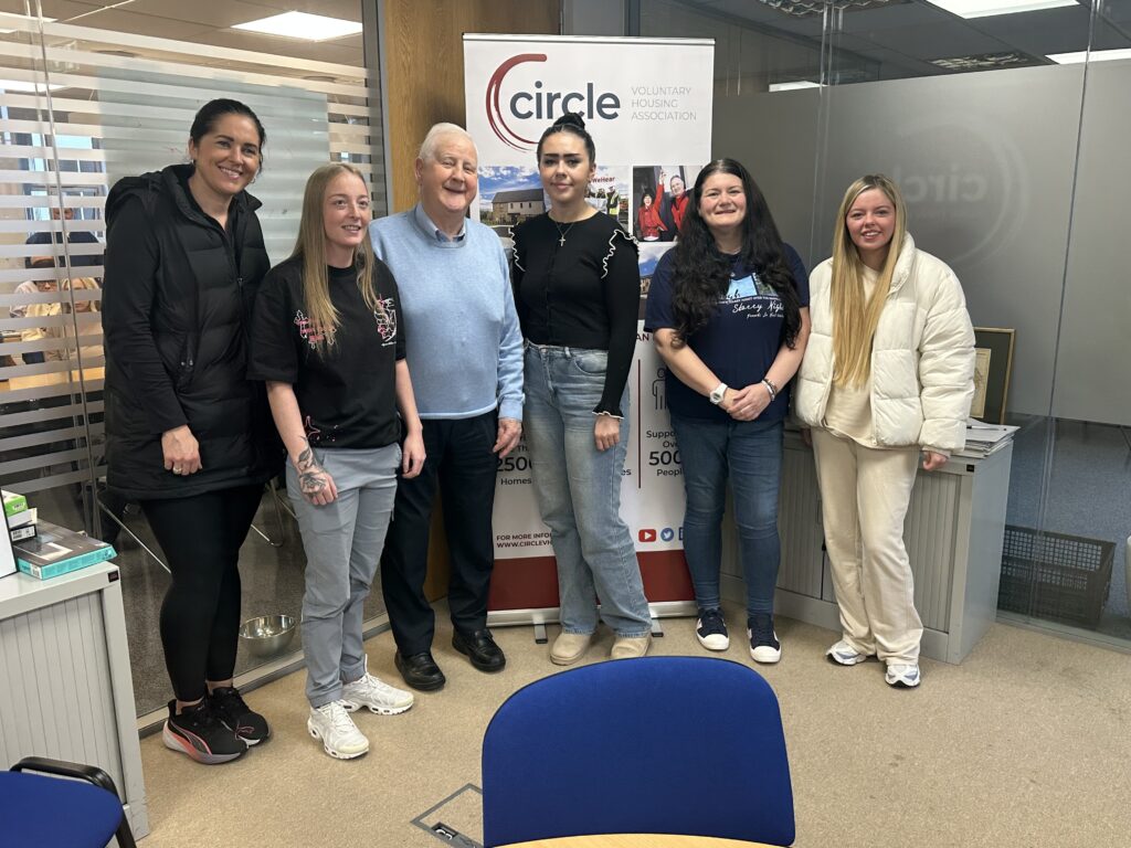 Fr.Patsy Carolan with Circle Tenants, presenting the cheque for the Tenant Educational Bursary.